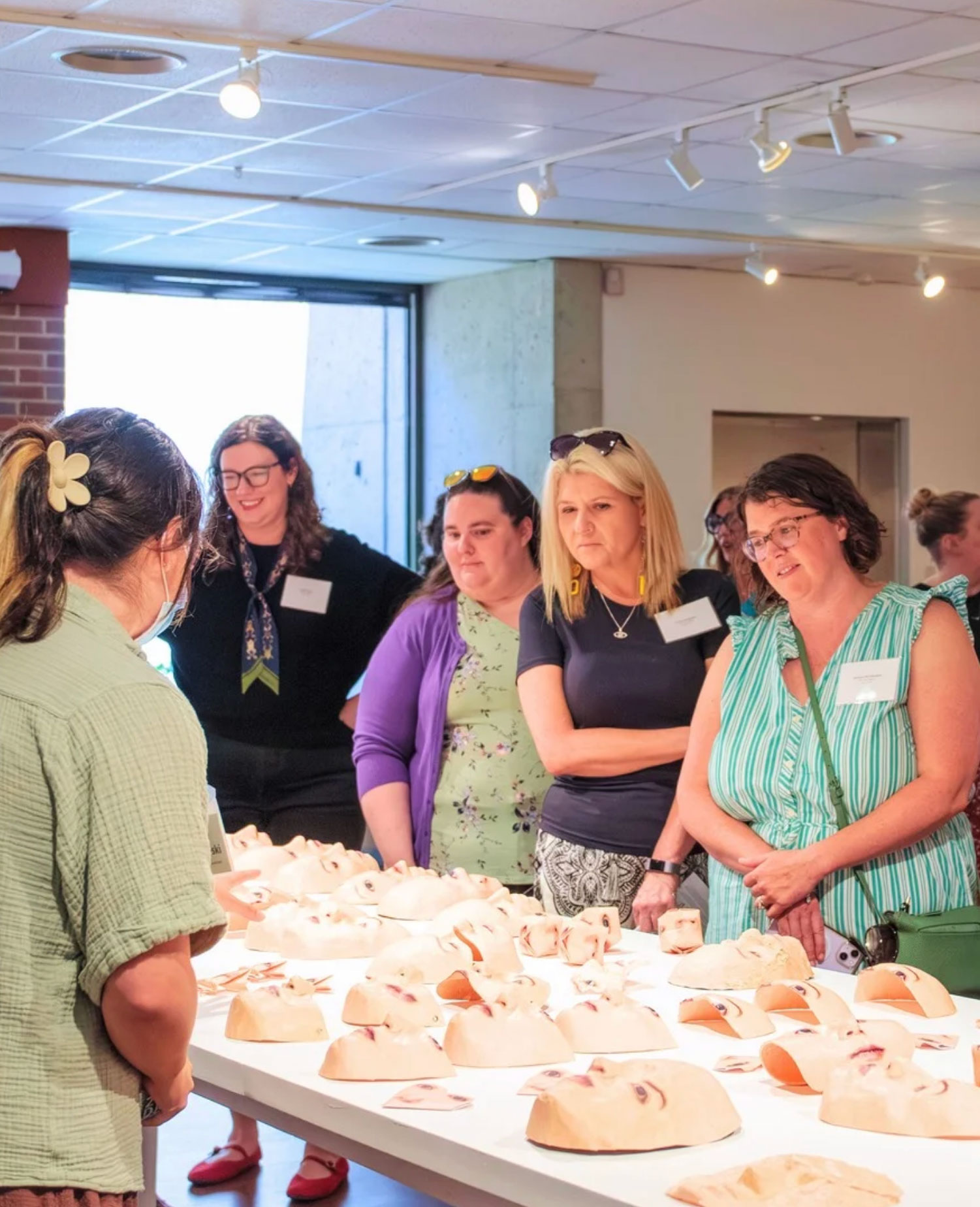 Doctoral students in the EdD view an exhibition at MoFA program.